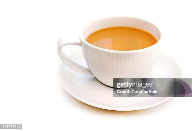 tea in tea cup - cup saucer stock pictures, royalty-free photos & images