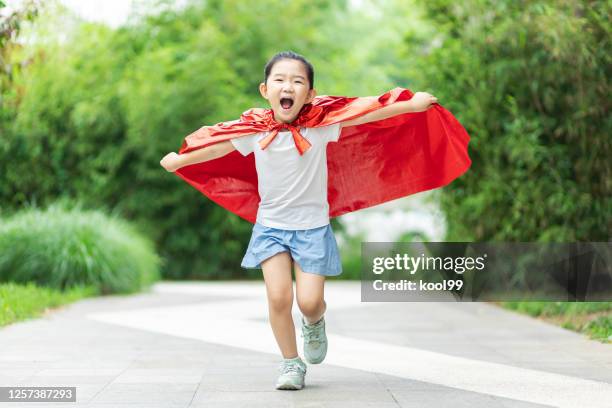 hero girl take off - superhero girl stock pictures, royalty-free photos & images