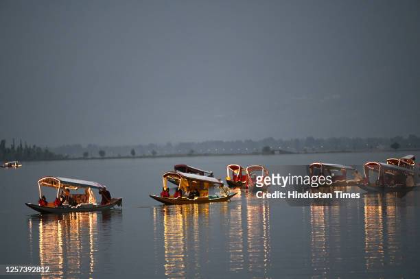 Delegates enjoy Shikara ride on the waters of Dal Lake on May 22, 2023 in Srinagar, India.