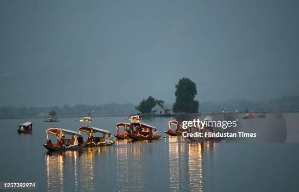 Delegates enjoy Shikara ride on the waters of Dal Lake on May 22, 2023 in Srinagar, India.