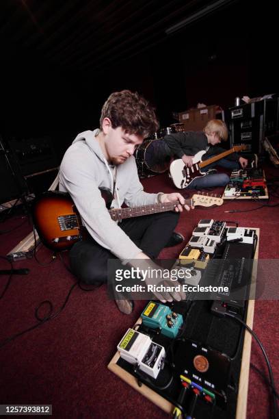 Joe Newman and Gwil Sainsbury of UK indie band Alt-J with their guitar effects pedalboards, United Kingdom, 2012.