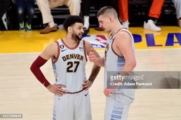 Jamal Murray of the Denver Nuggets talks with Nikola Jokic of the Denver Nuggets during Game 4 of the 2023 NBA Playoffs Western Conference Finals on...