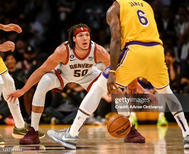 Aaron Gordon of the Denver Nuggets guards LeBron James of the Los Angeles Lakers during the second quarter of the Western Conference finals game 4 at...