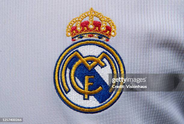 The Real Madrid club crest on the first team home shirt on July 19, 2020 in Manchester, United Kingdom.
