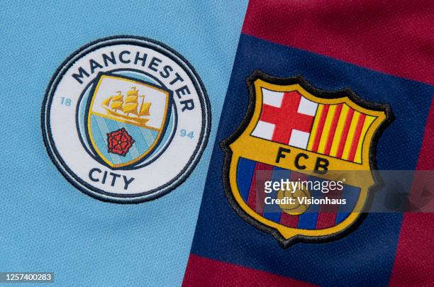 The FC Barcelona and Manchester City club crests on the first team home shirts on July 19, 2020 in Manchester, United Kingdom.