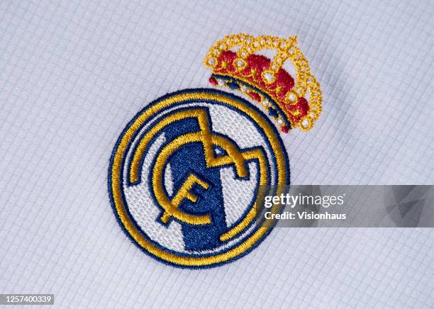 The Real Madrid club crest on the first team home shirt on July 19, 2020 in Manchester, United Kingdom.