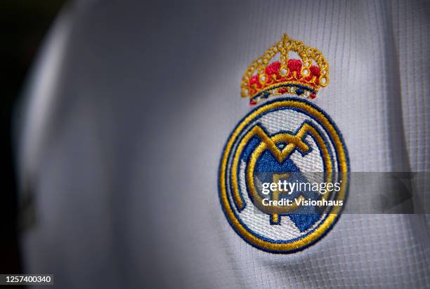 The Real Madrid club crest on the first team home shirt on July 19, 2020 in Manchester, United Kingdom.