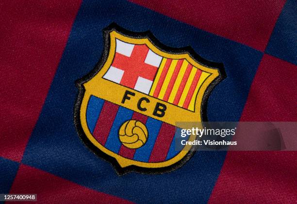 The FC Barcelona club crest on the first team home shirt on July 19, 2020 in Manchester, United Kingdom.