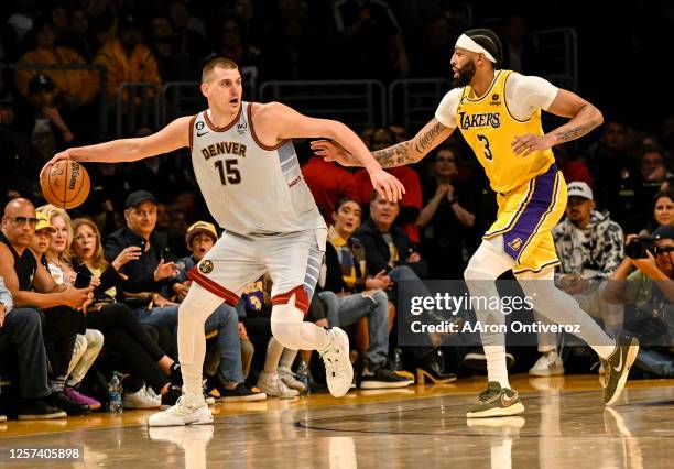 Nikola Jokic of the Denver Nuggets works as Anthony Davis of the Los Angeles Lakers defends during the fourth quarter of the Nuggets' 113-111 Western...