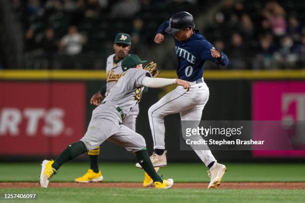 Shortstop Nick Allen of the Oakland Athletics tags out Sam Haggerty of the Seattle Mariners in the eighth inning at T-Mobile Park on May 22, 2023 in...