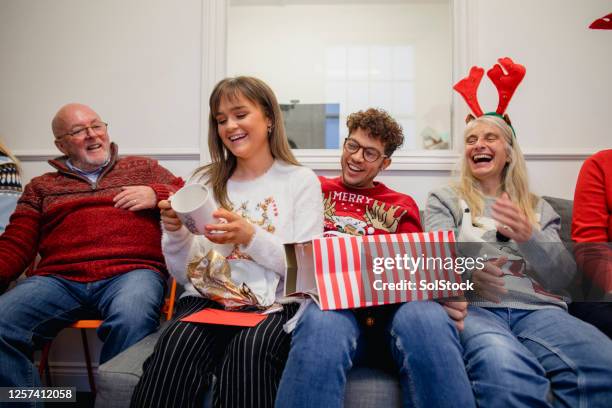 i love it! - ugly christmas sweater party stock pictures, royalty-free photos & images