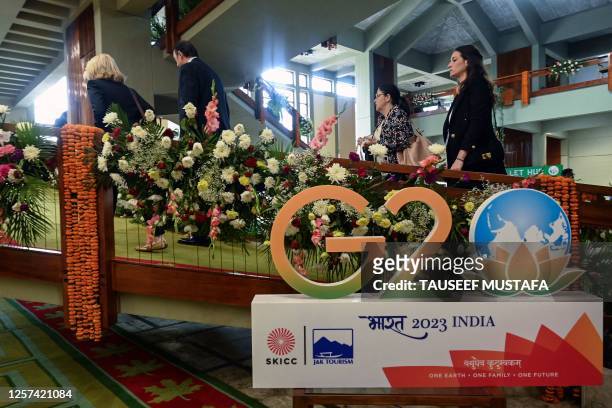 Foreign delegates arrives to attend a G20 tourism meeting at the SKICC convention centre in Srinagar on May 23, 2023. A G20 tourism meeting began on...