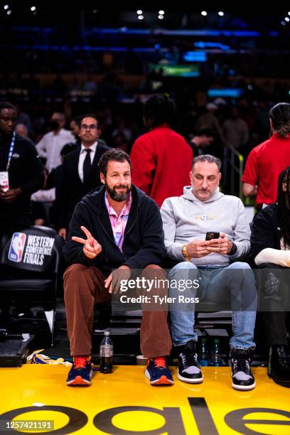 Adam Sandler sits court side during Round 3 Game 4 of the Western Conference Finals 2023 NBA Playoffs between the Denver Nuggets and Los Angeles...