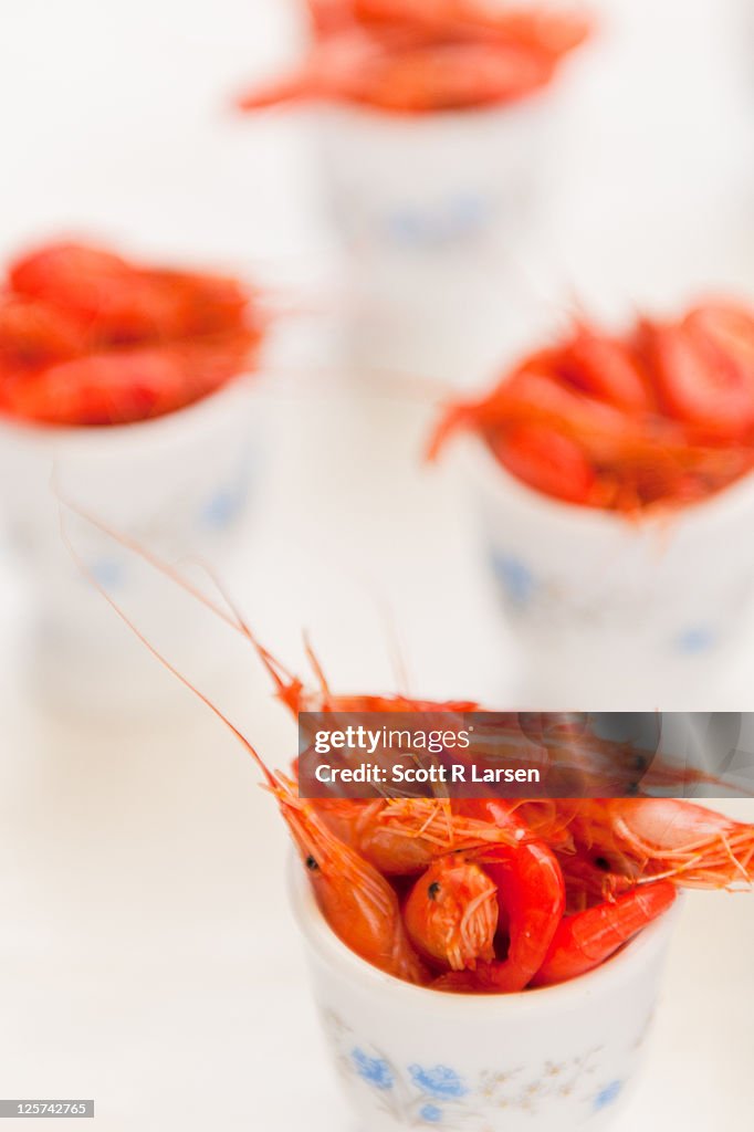 Shrimp for sale in small ceramic bowls