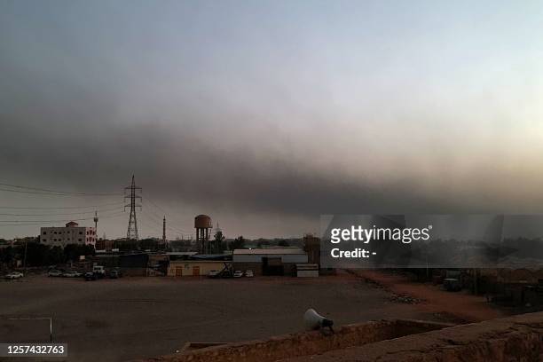 Smoke billows in Khartoum on May 23, 2023 after a one-week ceasefire between Sudan's army and paramilitary Rapid Support Forces officially went into...
