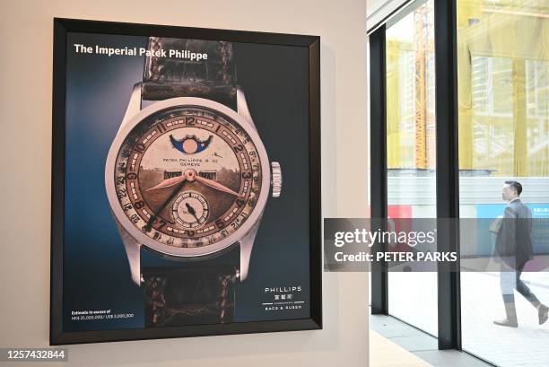 Poster of the Patek Philippe Ref 96 Quantieme Lune timepiece, once owned by Aisin-Gioro Puyi, the Chinese Qing dynasty's last emperor, is seen on...