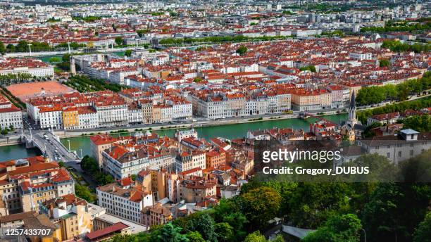 aerial view of lyon french cityscape with saone riverbank in summer with historic monuments along quayside - rhone stock pictures, royalty-free photos & images