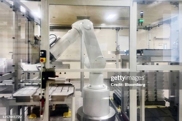 Robotic arm operating on the production line at the GSK Plc research and development center in Wavre, Belgium, on Thursday, May 11, 2023. The Belgian...