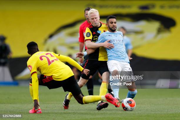 Will Hughes of Watford battles for possession with Riyad Mahrez of Manchester City during the Premier League match between Watford FC and Manchester...