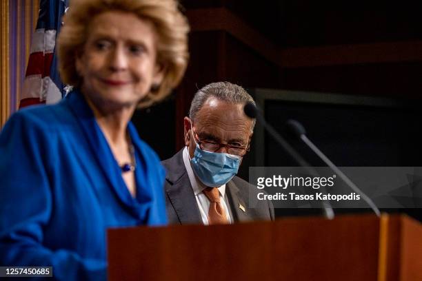 Sen. Debbie Stabenow speaks as Senate Minority Leader Chuck Schumer listens at a press conference on Capitol Hill on July 21, 2020 in Washington, DC....