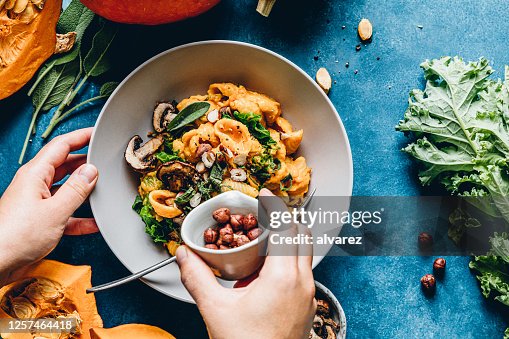 Woman preparing autumn pumpkin meal Woman preparing autumn pumpkin meal
