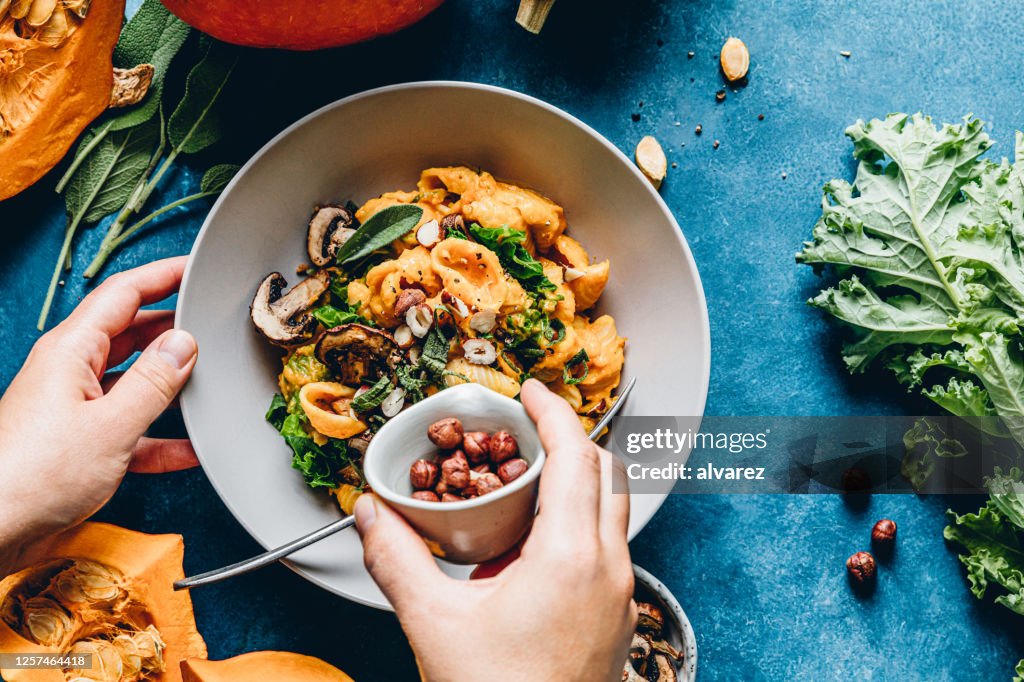 Woman preparing autumn pumpkin meal