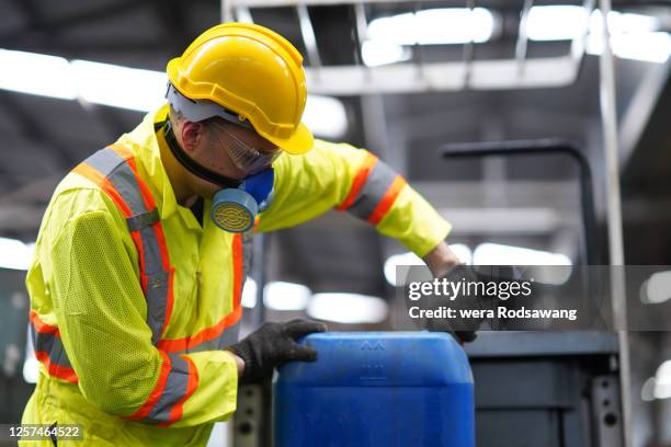factory worker working in the risk toxic waste - toxic waste stock pictures, royalty-free photos & images