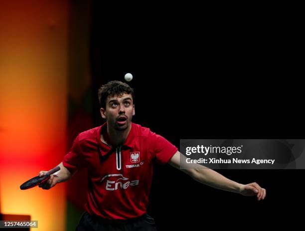 Jakub Dyjas of Poland serves during the men's singles first round match between Lin Gaoyuan of China and Jakub Dyjas of Poland at 2023 ITTF Table...