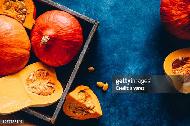 pumpkins in a wooden box - gourd family stock pictures, royalty-free photos & images