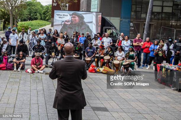 People gather at Pecham square during a demonstration to honor the works of Sasha Johnson. Sasha Johnson was a founding member of the Taking The...