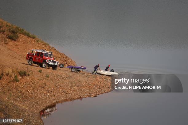 Portuguese firefighters launch a boat during a new search operation amid the investigation into the disappearance of Madeleine McCann in the Arade...