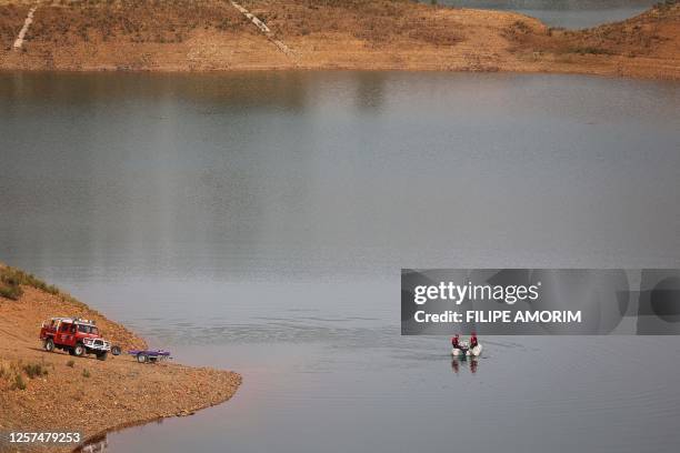 Portuguese firefighters work onboard a boat during a new search operation amid the investigation into the disappearance of Madeleine McCann in the...