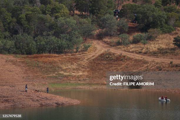 Portuguese firefighters work onboard a boat during a new search operation amid the investigation into the disappearance of Madeleine McCann in the...