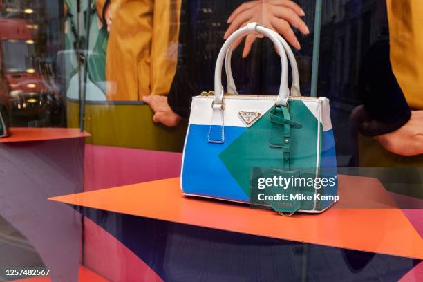 Prada handbag in a shop window of their store on Bond Street on 22nd May 2023 in London, United Kingdom. Bond Street is one of the principal streets...