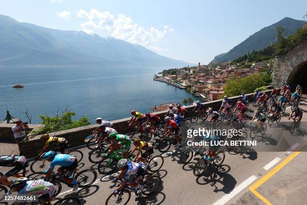 The pack rides during the sixteenth stage of the Giro d'Italia 2023 cycling race, 203 km between Sabbio Chiese and Monte Bondone, near Cavedine, on...