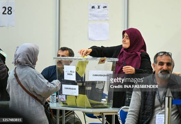 Woman casts her ballot at a polling station set up in the Grugahalle hall in Essen, western Germany, on May 23 ahead of Turkey's first run-off...