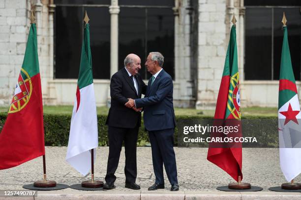 Portugual's President Marcelo Rebelo de Sousa welcomes Algeria's President Abdelmadjid Tebboune at the Jeronimos Monastery in Lisbon on May 23, 2023.