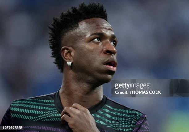 Real Madrid's Brazilian forward Vinicius Junior warms up prior the UEFA Champions League semi-final first leg football match between Real Madrid CF...