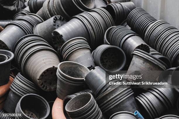 high angle view of re-using plastic plant pots - plastic flower pot stock pictures, royalty-free photos & images