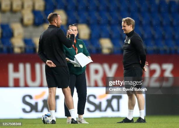 Felcsút , Hungary - 23 May 2023; Republic of Ireland head coach Colin O'Brien, right, with coach David Meyler and operations manager Denise...