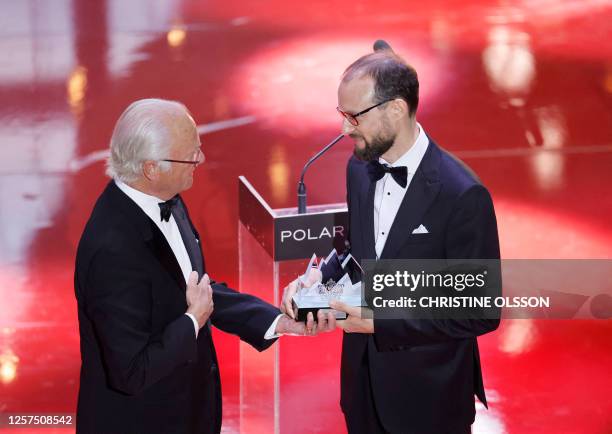 Michael Pärt , son of laureate Estonian composer Arvo Pärt , accepts the Polar Music Prize Award on behalf of his father, from Sweden's King Carl XVI...