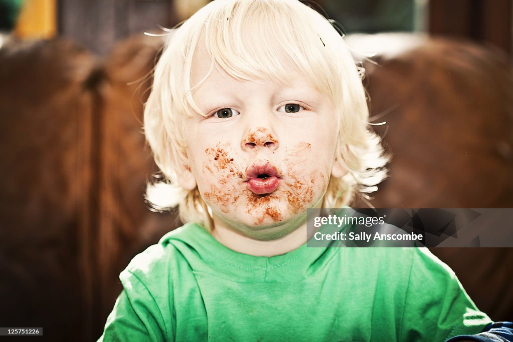 Child with face covered in chocolate