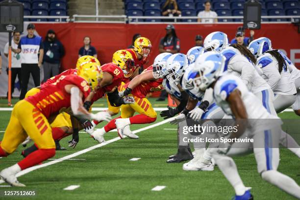 The Philadelphia defensive line rushes against the New Orleans offensive line during a regular season USFL football game between the New Orleans...