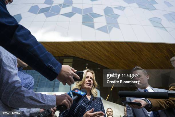 Rachel Notley, Alberta New Democratic Party candidate for Alberta premier,speaks with members of the media after voting at an advance polling station...