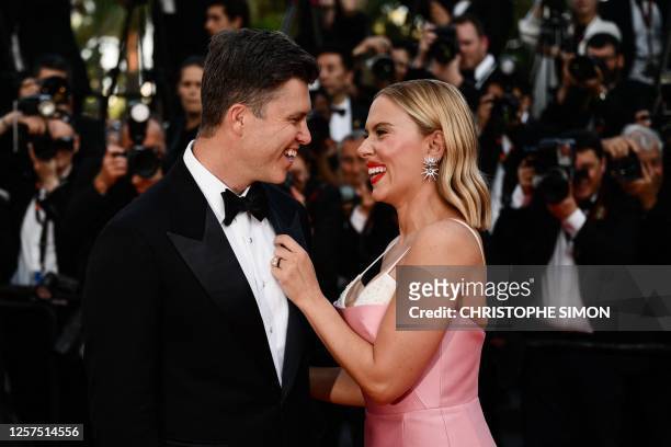 Actress Scarlett Johansson and US comedian Colin Jost arrive for the screening of the film "Asteroid City" during the 76th edition of the Cannes Film...