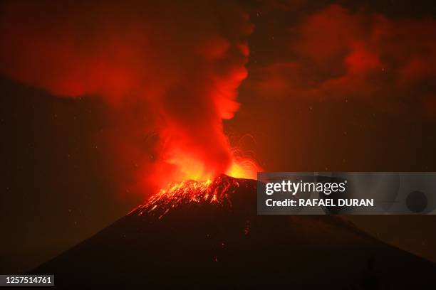 Incandescent materials, ash and smoke are spewed from the Popocatepetl volcano as seen from the San Nicolas de los Ranchos community, state of...