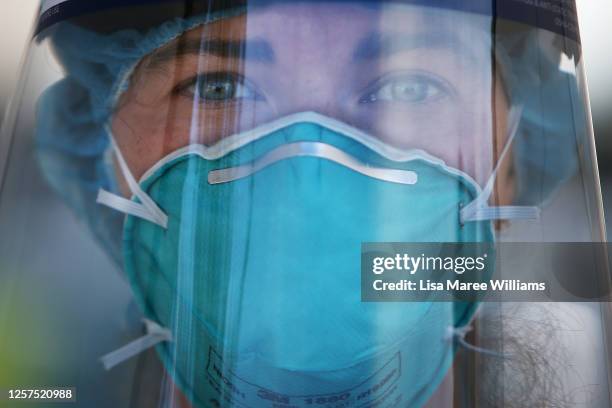 Registered Nurse Ali Murphy is seen wearing PPE at a Bondi Beach COVID-19 drive-through testing clinic on July 22, 2020 in Sydney, Australia. New...