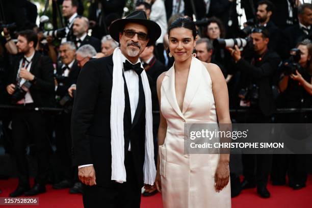 French-Afghan writer and film director and member of the Jury of the 76th Cannes Film Festival Atiq Rahimi arrives with French actress Alice Rahimi...