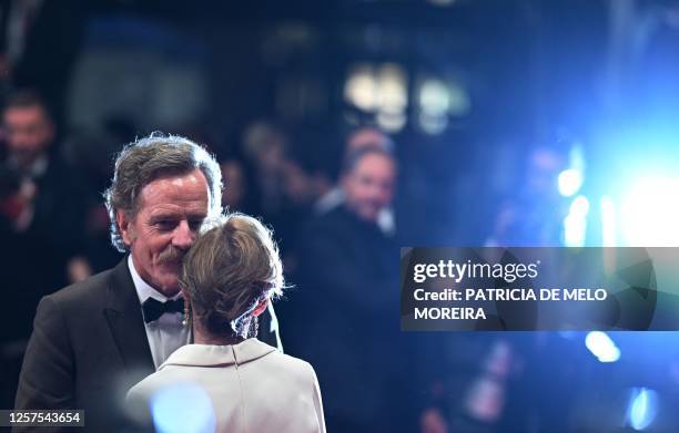 Actor Bryan Cranston and his wife actress Robin Dearden pose after the screening of the film "Asteroid City" during the 76th edition of the Cannes...