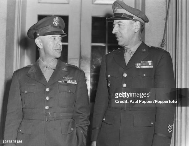 General George Kenney , Commander of the Allied Air Forces in the Southwest Pacific Area, stands on left with Major General Richard K Sutherland ,...